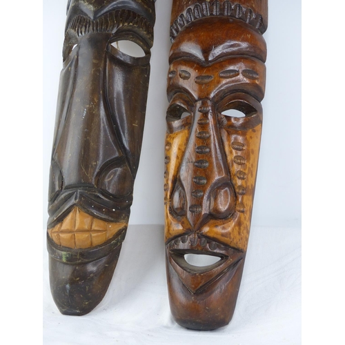 221 - Two carved wooden tribal wall masks.