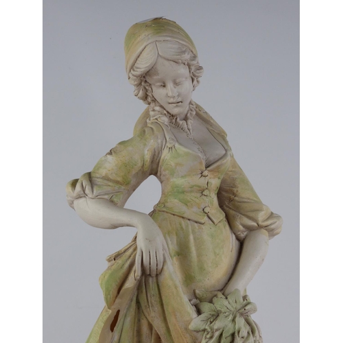 222 - An antique style chalk ware figure of a girl with goat.