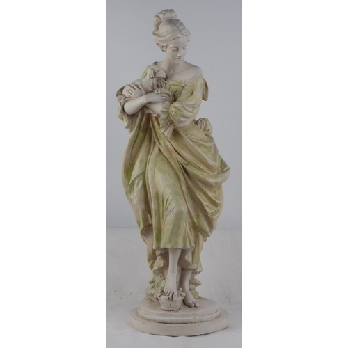 228 - An antique style chalk ware figure of a girl with goat.