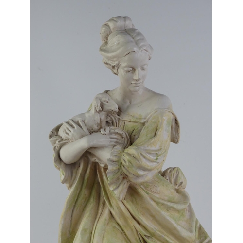 228 - An antique style chalk ware figure of a girl with goat.