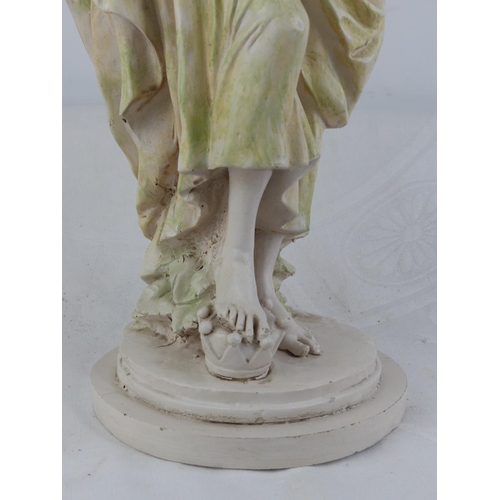 228 - An antique style chalk ware figure of a girl with goat.