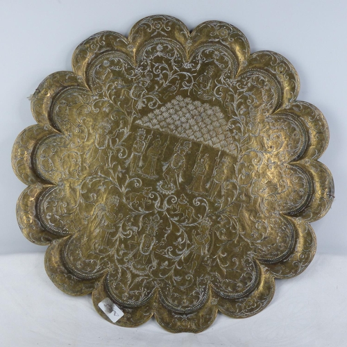 229 - An antique brass Chinese charger.