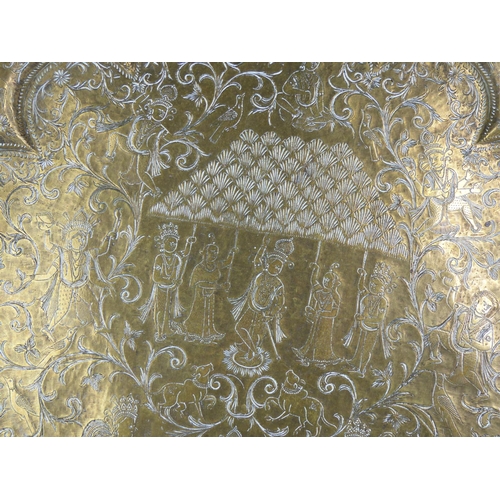 229 - An antique brass Chinese charger.