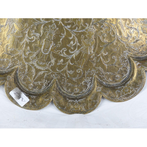 229 - An antique brass Chinese charger.