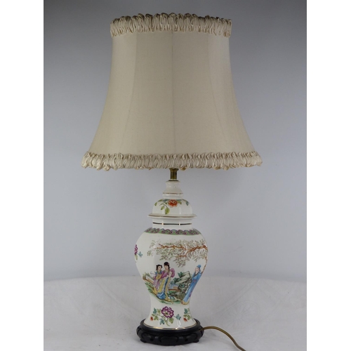 232 - A vintage Chinese design table lamp with decorative design and shade.