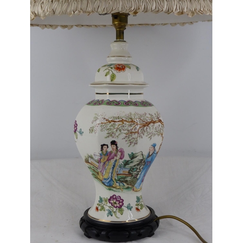 232 - A vintage Chinese design table lamp with decorative design and shade.