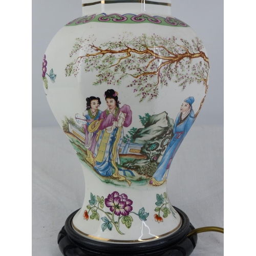 232 - A vintage Chinese design table lamp with decorative design and shade.