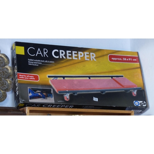 233 - A boxed car creeper, measuring 28cm x 91cm.