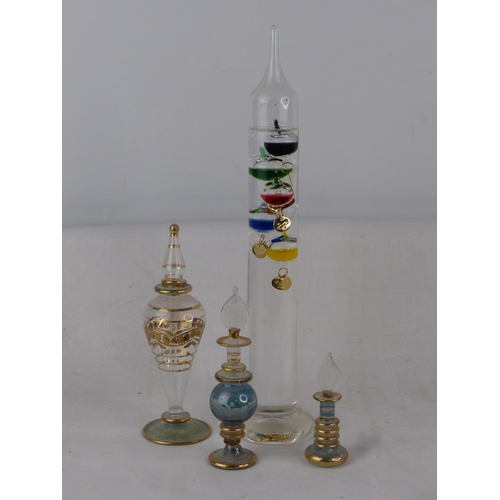 238 - Three glass perfume bottles and a Galileo glass thermometer.