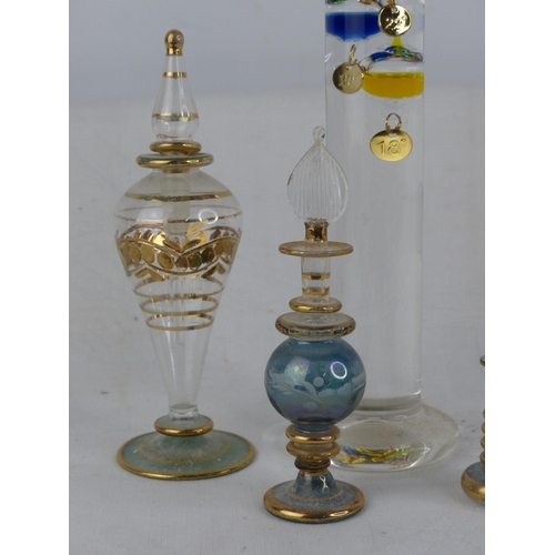 238 - Three glass perfume bottles and a Galileo glass thermometer.