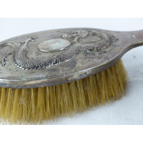 532 - Two Chinese Export Silver backed dressing table brushes with dragon design.