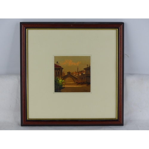 558 - A small framed oil painting of a continental scene, signed.