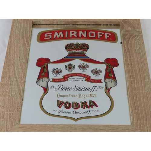 100 - A framed 'Smirnoff Vodka' pub advertising mirror, measuring 29cm x 38cm.