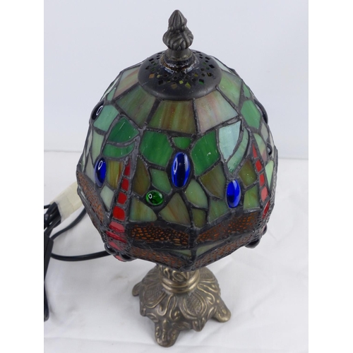 18 - A small Tiffany glass table lamp with dragonfly design shade, measuring 28cm.