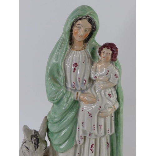 30 - An antique Staffordshire figure, 'Mary and Child', measuring 13