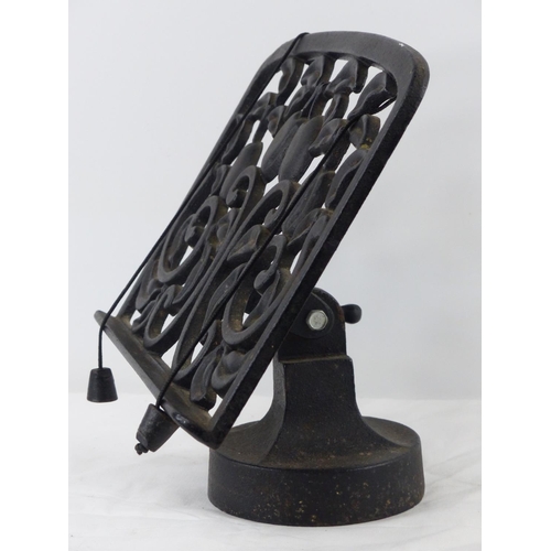 36 - A cast iron cookery book stand.