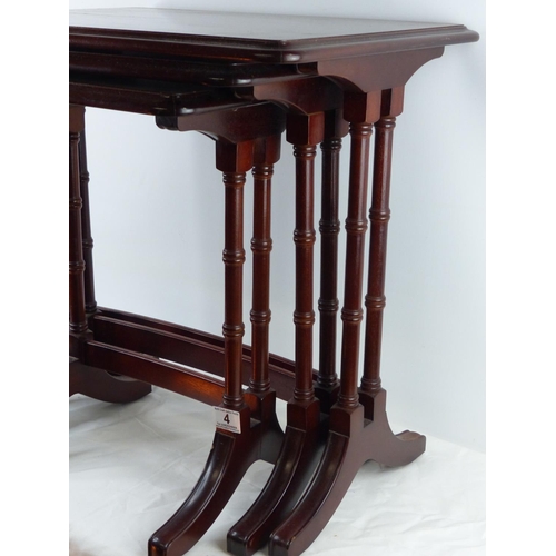 4 - A mahogany nest of tables, measuring 54cm x 38cm.