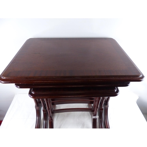 4 - A mahogany nest of tables, measuring 54cm x 38cm.