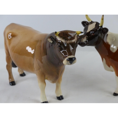 49 - A Beswick 'CH Dunsley Coy Boy' cow (a/f), another Beswick cow and ram.