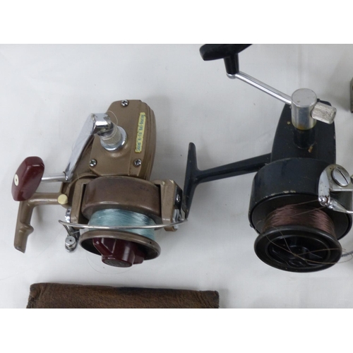 76 - A collection of fishing reels & accessories.