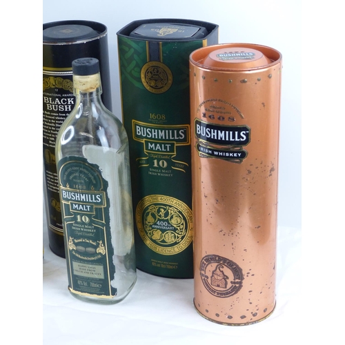 79 - A lot of Bushmills Whisky tin boxes and more.