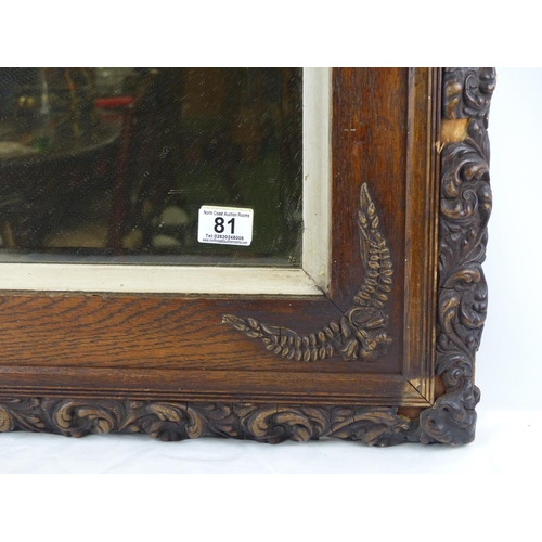 81 - A stunning oak framed wall mirror with carved detail, measuring 75cm x 66cm.