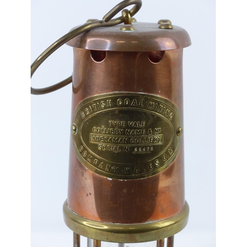 84 - A copper and brass 'British Coal Mining Company' miners lamp