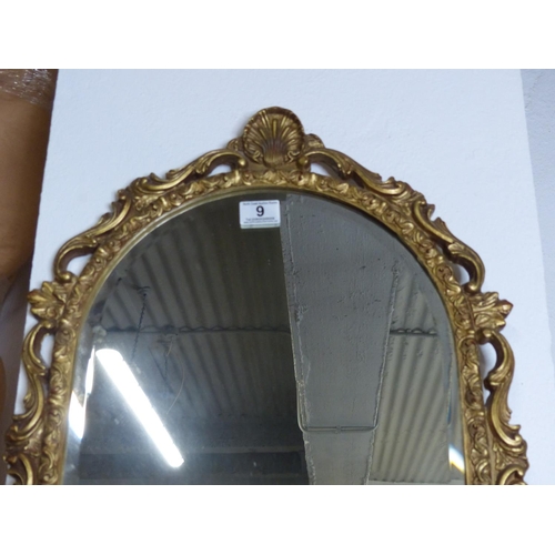 9 - A stunning gilt resin framed arch top wall mirror, measuring 110cm x 34cm.