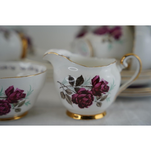 107 - A vintage Adderley bone china 'Persian Rose' tea set including cake plate.