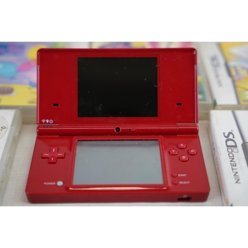 137 - A Nintendo DS and a selection of games.