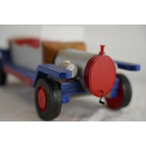 139 - A handmade wooden model car, measuring 37cm x 11cm.