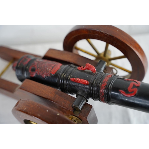 140 - A vintage/ antique hand painted model of a Louis XIV model cannon, measuring 53cm x 22cm.