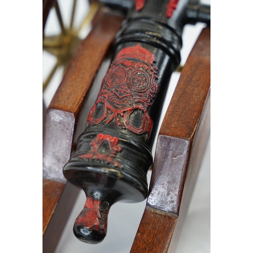 140 - A vintage/ antique hand painted model of a Louis XIV model cannon, measuring 53cm x 22cm.