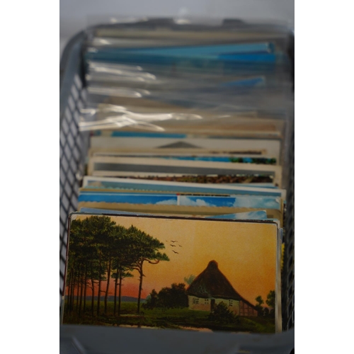 144 - A vintage album of postcards and more.