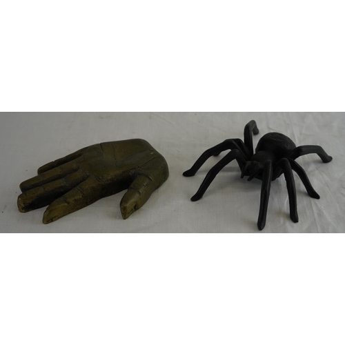 169 - A cast metal spider, measuring 15cm x 14cm and cast brass hand.