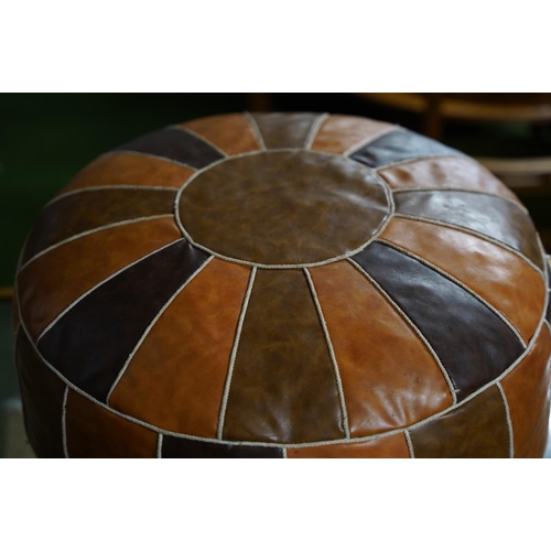 172 - A Moroccan style leather pouffe, measuring 54cm x 30cm.