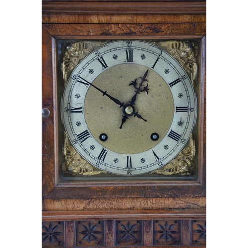 208 - A Walnut cased mantle clock with brass dial, measuring 36cm x 25cm,