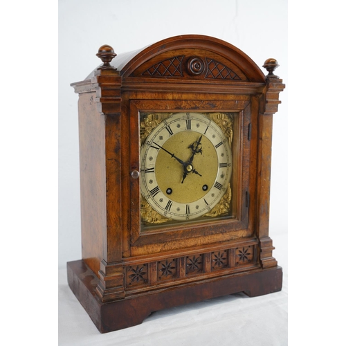 208 - A Walnut cased mantle clock with brass dial, measuring 36cm x 25cm,