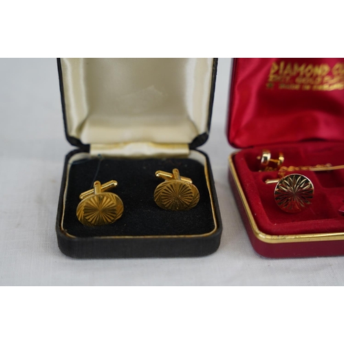 226 - A cased set of 22ct gold plated cufflink set and more.