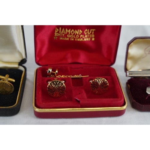 226 - A cased set of 22ct gold plated cufflink set and more.