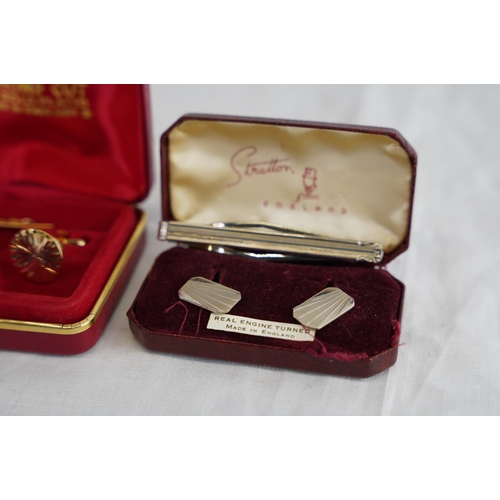 226 - A cased set of 22ct gold plated cufflink set and more.