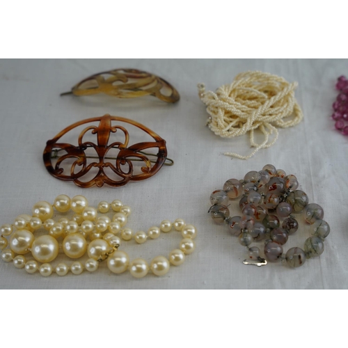 237 - A lot of vintage beaded and pearl necklaces, hair combs and more.