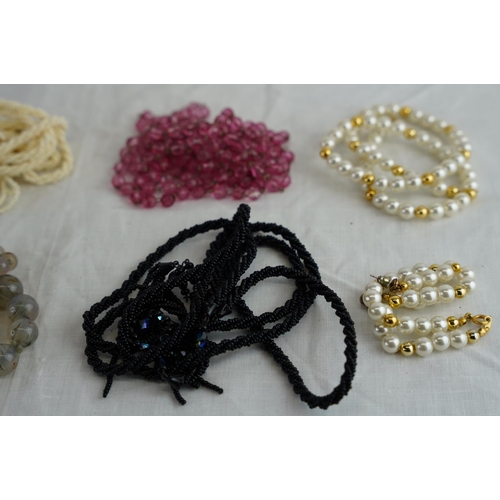 237 - A lot of vintage beaded and pearl necklaces, hair combs and more.