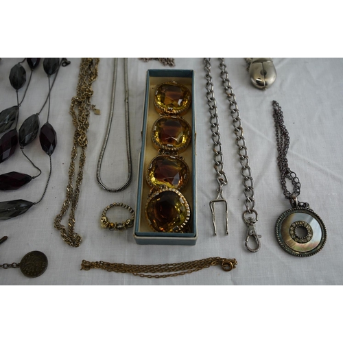 241 - A collection of chains, pocket watch and more.