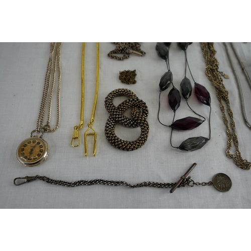 241 - A collection of chains, pocket watch and more.