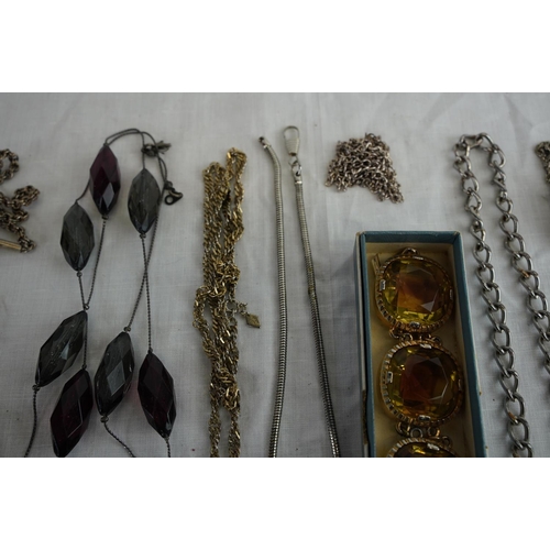 241 - A collection of chains, pocket watch and more.