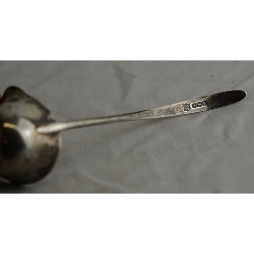 243 - A Sterling silver ladle with pourer, Sheffield 1922, weight 20g.