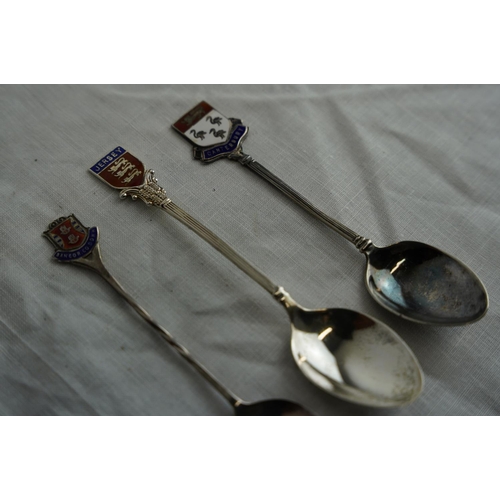 245 - Three Sterling silver and enamel teaspoons.