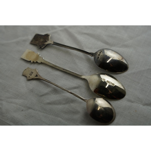 245 - Three Sterling silver and enamel teaspoons.