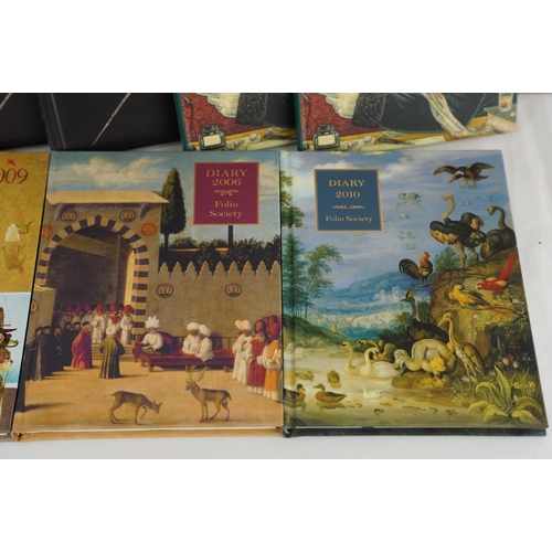 429 - Eight Folio Society diaries.